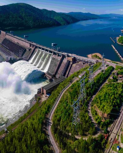 Hydroelectric dam on the river, water discharge from the reservoir, aerial photography