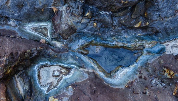 A top view of wet rocks in Rio Tinto mining park