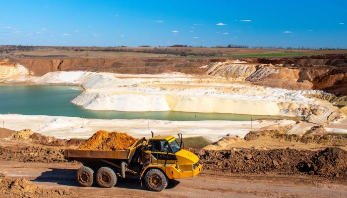 Big truck works at quartz sand quarry