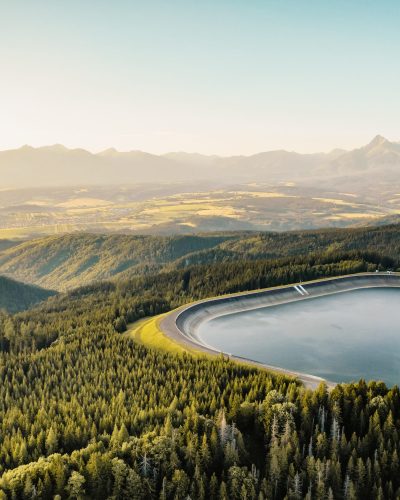 Hydroelectric power plant Cierny Vah. Sunset in Slovakia, Liptov. High Tatras scenery. Monumental peaks over water level